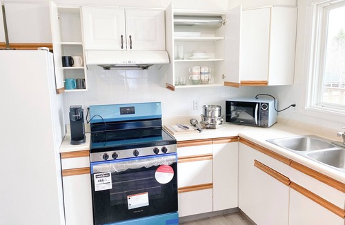 Ranchlands House | 2 Bed rooms, 3 beds with garage for a cozy stay in Calgary