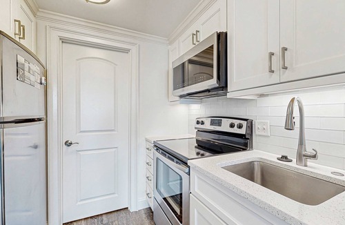 West Beach Village House | Third floor home with stunning private-deck ocean views - steps from beach