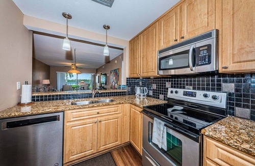 Isla del Sol Villa | Waterfront 2BR/2BA condo in St. Petersburg with pool, hot tub, and balcony.