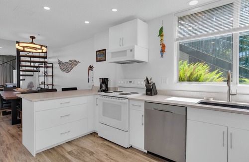 Yellow Point House | Waterfront Renovated unit 2 bed 2 bath with pools & boat dock sleeps 6
