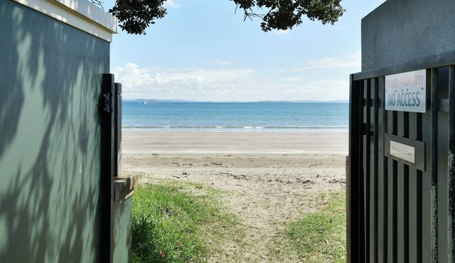 Experience a Kiwi beach holiday here, a couple of minutes walk to the sand .