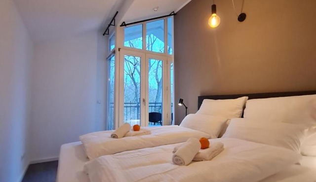 Penthouse in Villa am Wasser + Parken + WLAN + Netflix +Kamin