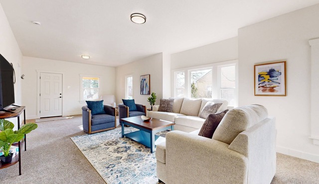 Perfectly located home with open layout, well-equipped kitchen, smart TV, & W/D