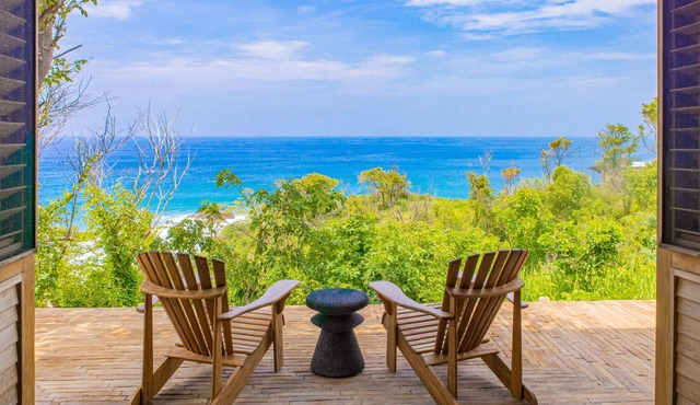 Spacious beachside home with pool, tropical garden, and oceanview lounging
