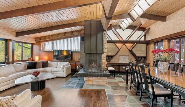 Spacious MCM home blends elegance w/retro charm. Includes pool, steam and sauna in Brookfield