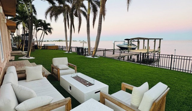 Spacious Waterfront Tropical Oasis: Hot Tub, Dock & Turf