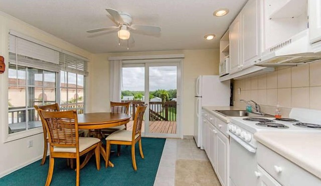 Waterfront Villa With Large Deck And Screened Front Porch Overlooking The Pool
